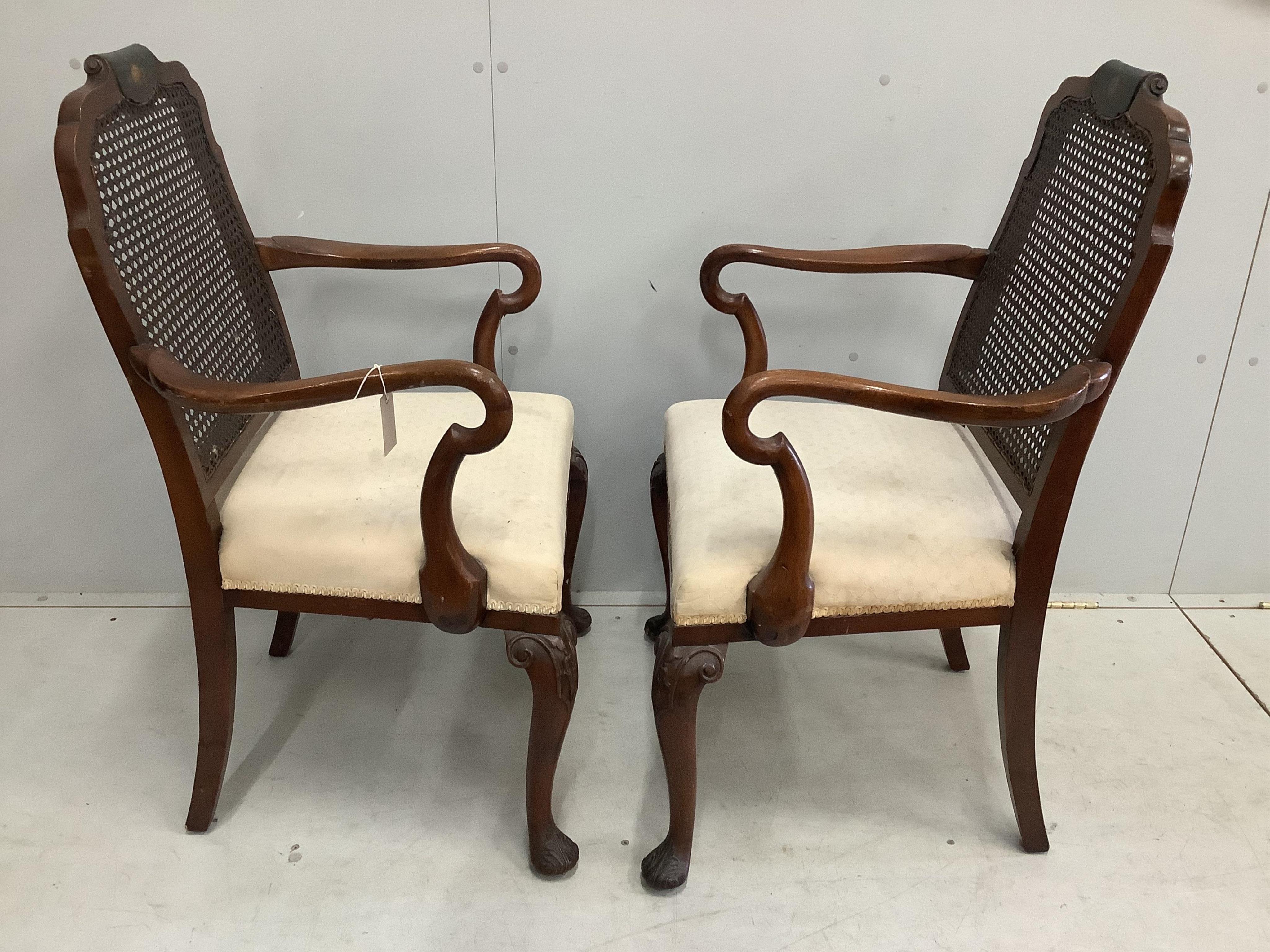 Four (two pairs) George I style painted walnut caned chairs and a similar circular nest of tables